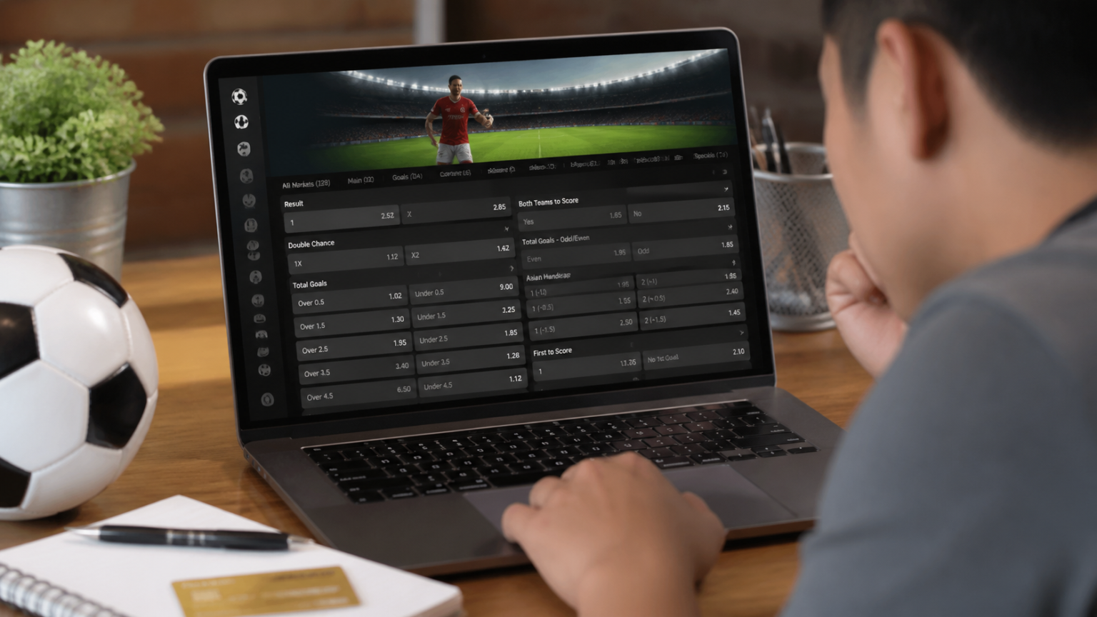 Online Sports Betting Malaysia: What Readers Should Know Person viewing online sports betting odds on a laptop
